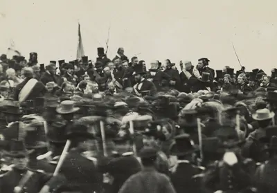 In one of the only known photos of Abraham Lincoln taken on the day of the Gettysburg Address, Lincoln can be seen seated, hatless, just below and to the right of the flag. Lincoln began developing symptoms of smallpox on the train home to Washington, DC. In one of the only known photos of Abraham Lincoln taken on the day of the Gettysburg Address, Lincoln can be seen seated, hatless, just below and to the right of the flag. Lincoln began developing symptoms of smallpox on the train home to Washington, DC.